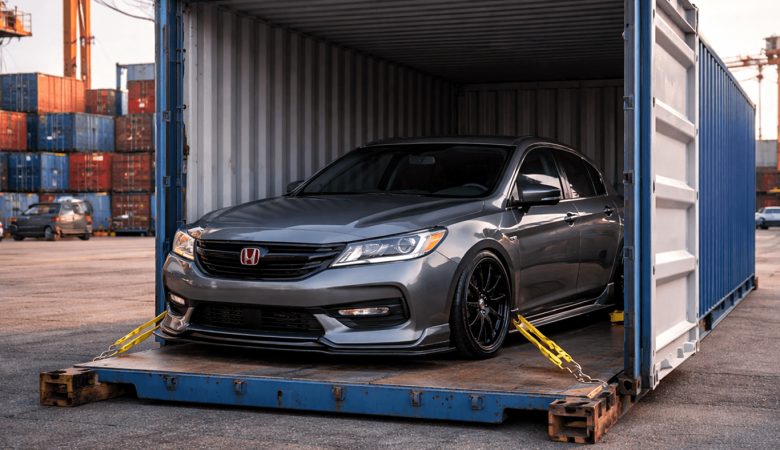A grey Honda secured inside a shipping container at a cargo port