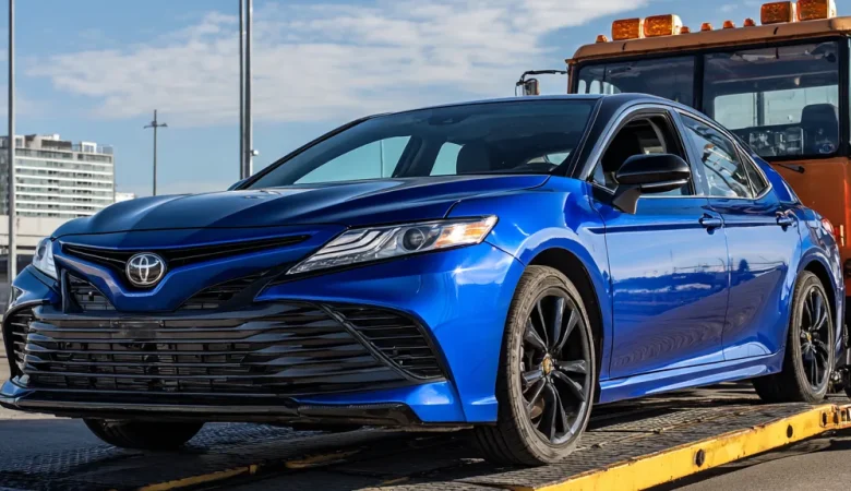 Toyota being towed on a flatbed